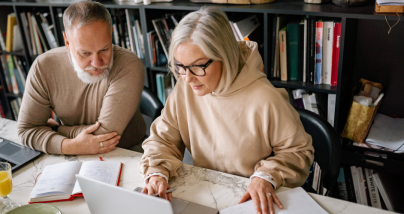 couple looking at paperwork and financial planning under the One Big Beautiful Bill Act