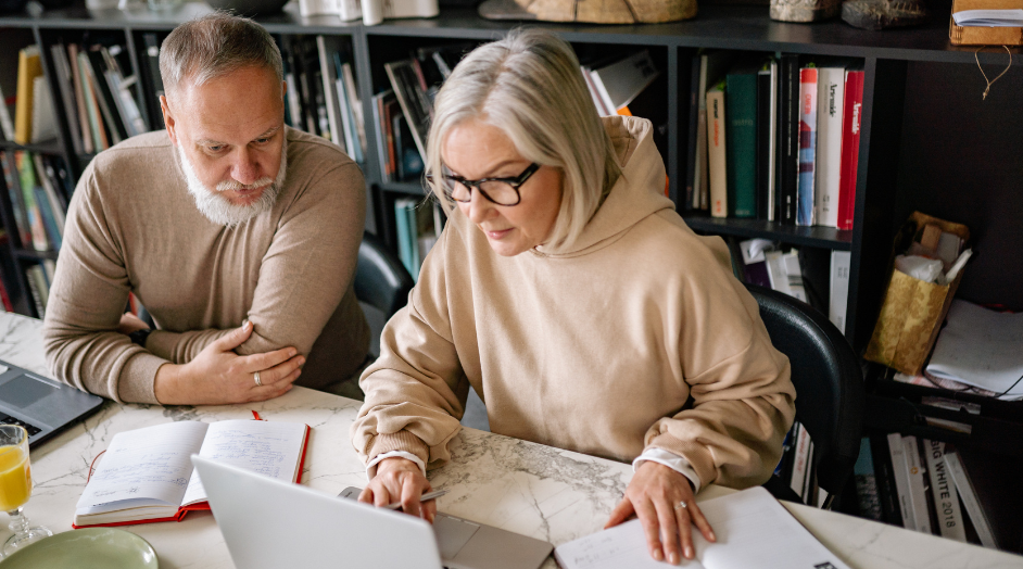 couple looking at paperwork and financial planning under the One Big Beautiful Bill Act